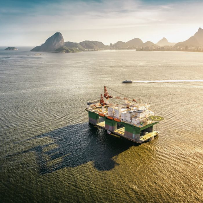 Oil drilling rig against panorama of Rio De Janeiro, Brazil